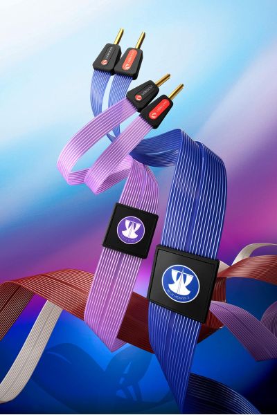 Flat ribbon-style speaker cables from Nordost in red, blue, and purple tones against a gradient background