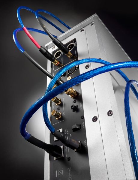 Blue Nordost cables neatly connected to the rear panel of an audio component